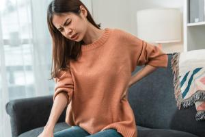 A woman experiencing body aches